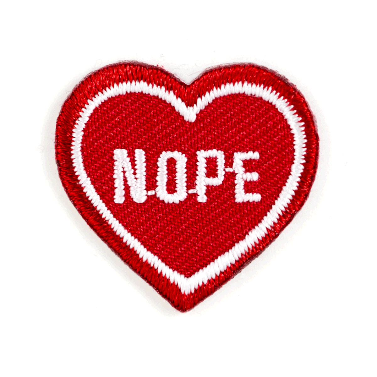 Heart-shaped patch with 'NOPE' text on a white background