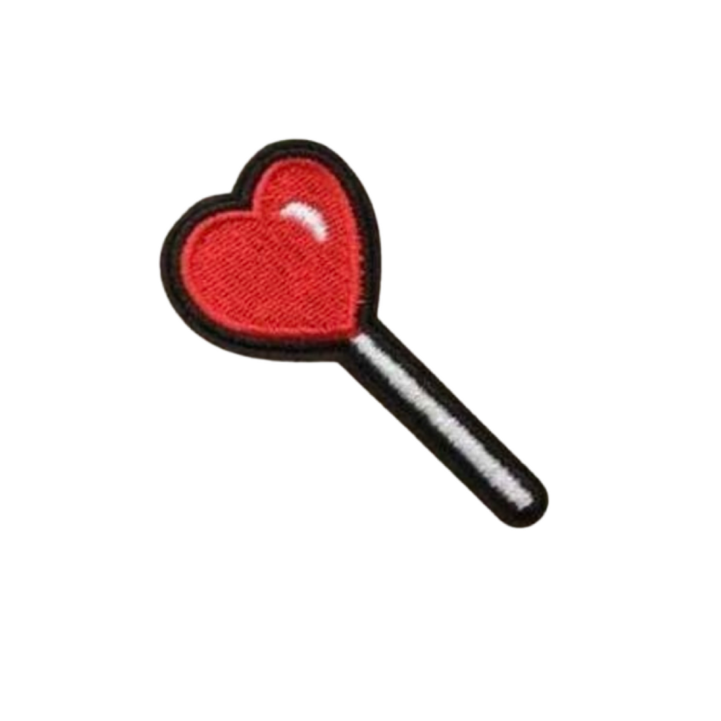 Red heart-shaped lollipop on a white background