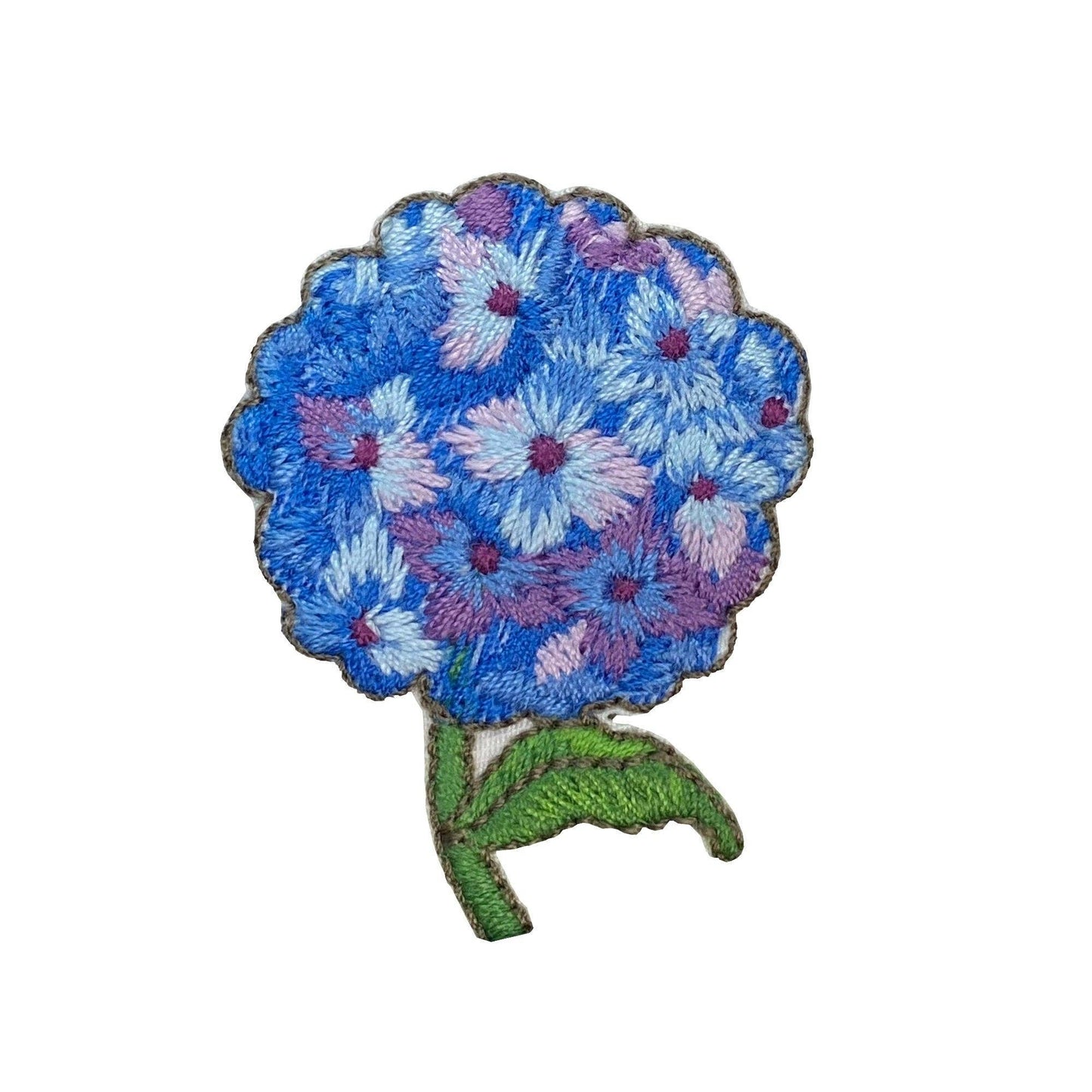 Floral patch with blue and pink flowers on a white background