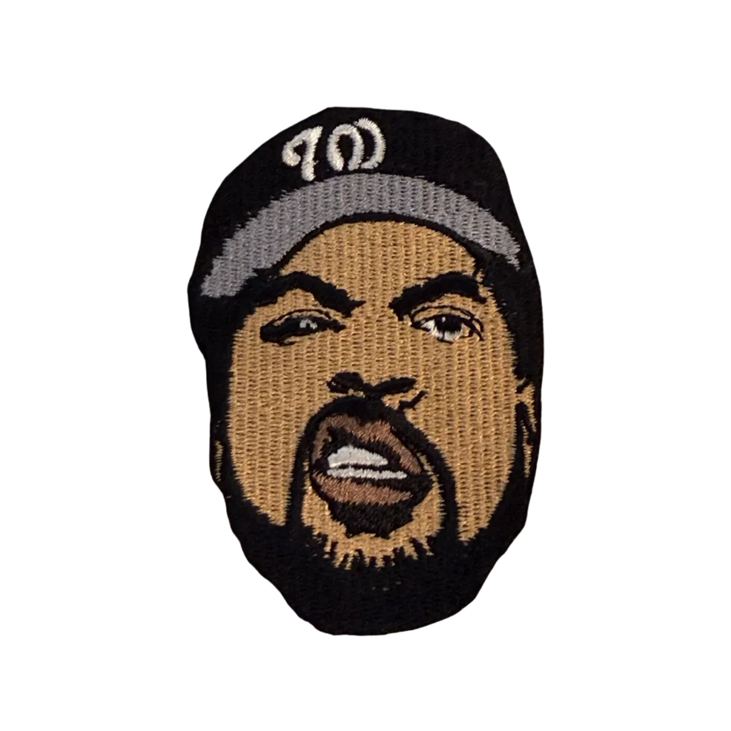 Embroidered patch of a person wearing a cap on a beige background