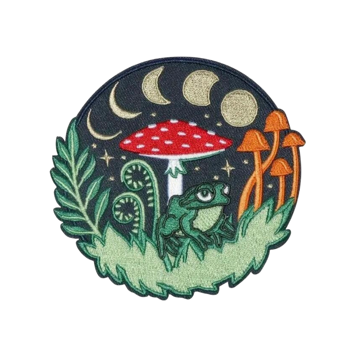Embroidered patch with a frog, mushrooms, and celestial design on a dark background