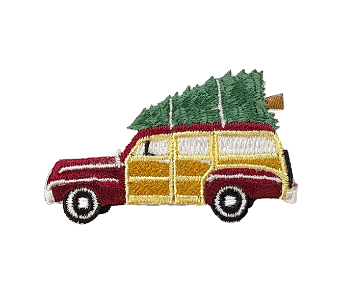 Embroidered patch of a vintage car with a Christmas tree on a white background