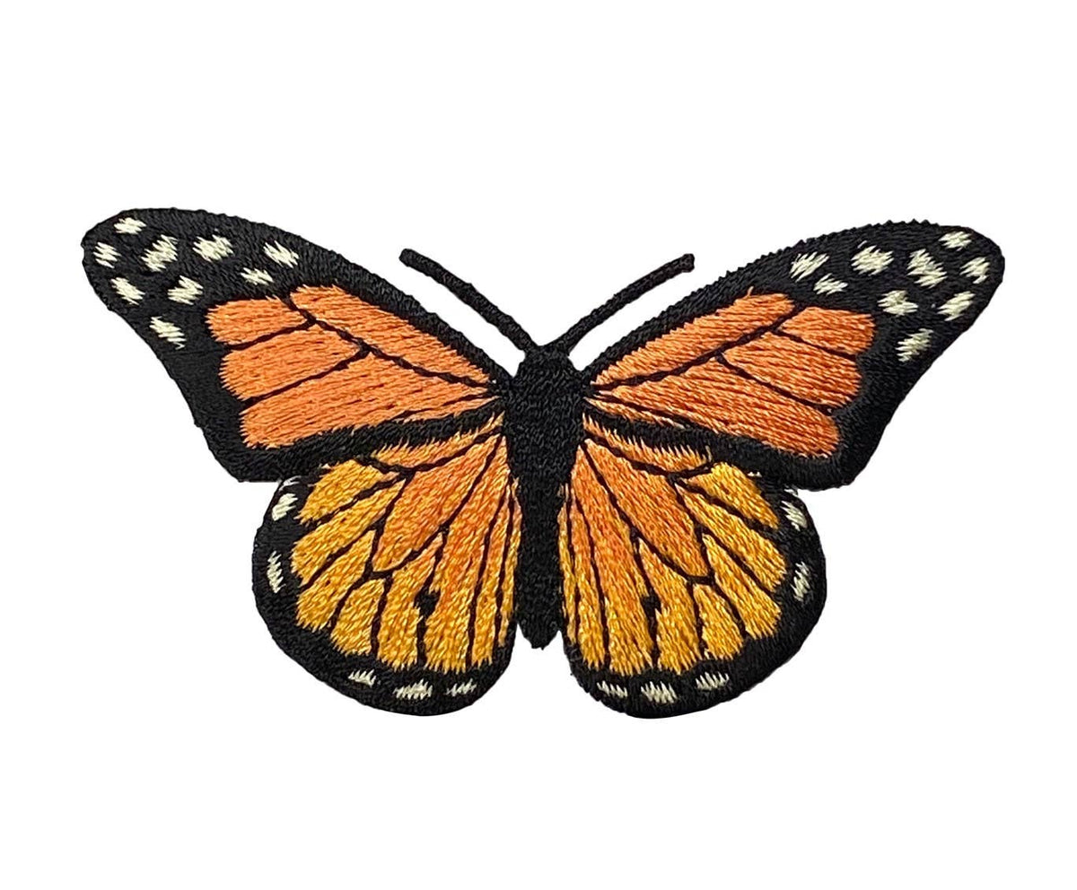 Butterfly patch with orange and black wings on a white background