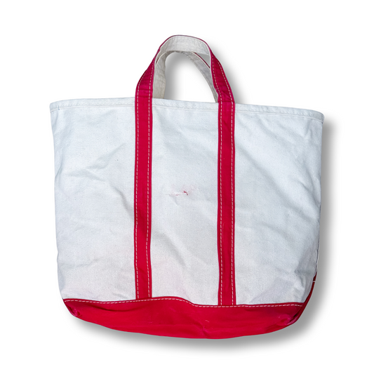 White tote bag with red accents on a white background