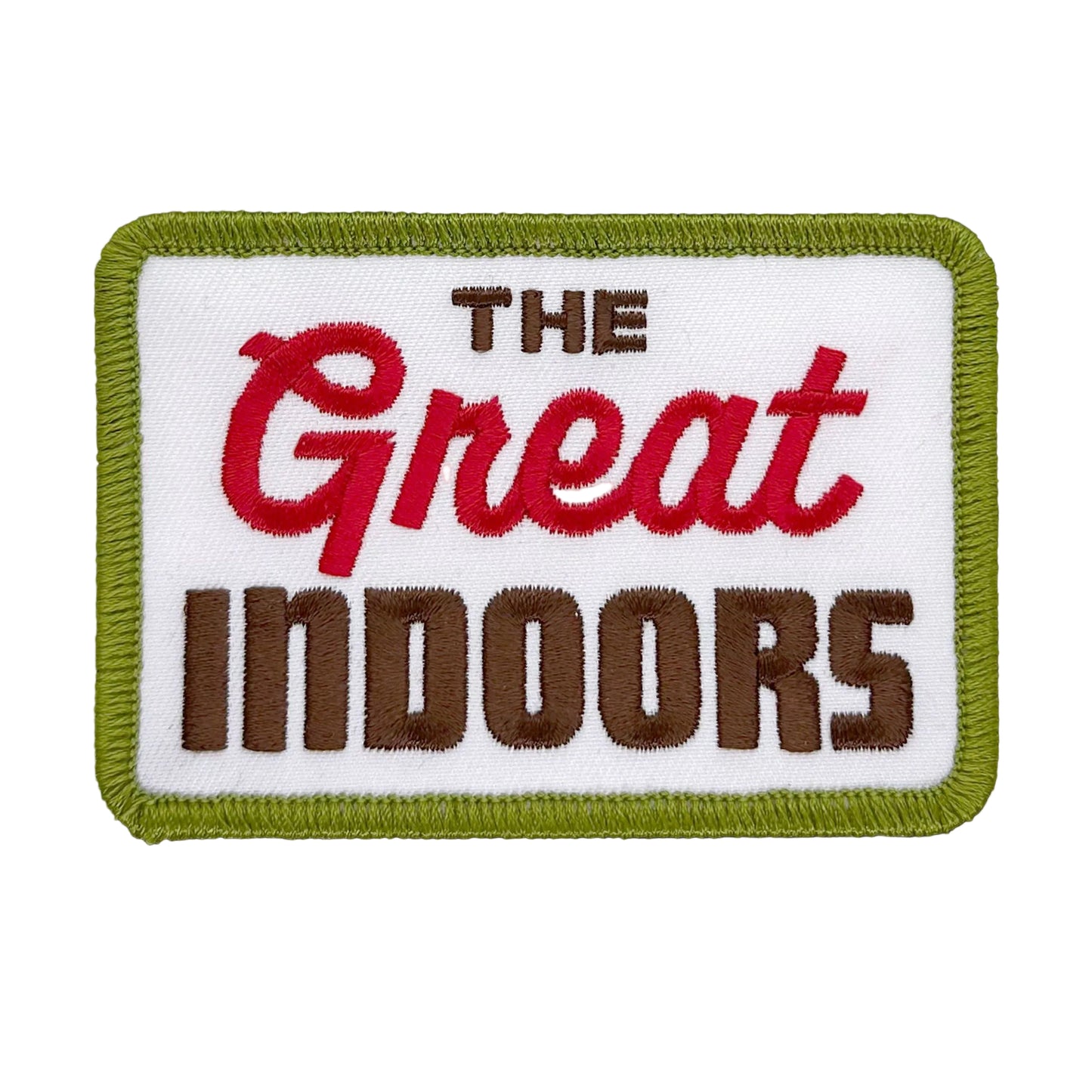 Embroidered patch with 'The Great Indoors' text on a white background with green border