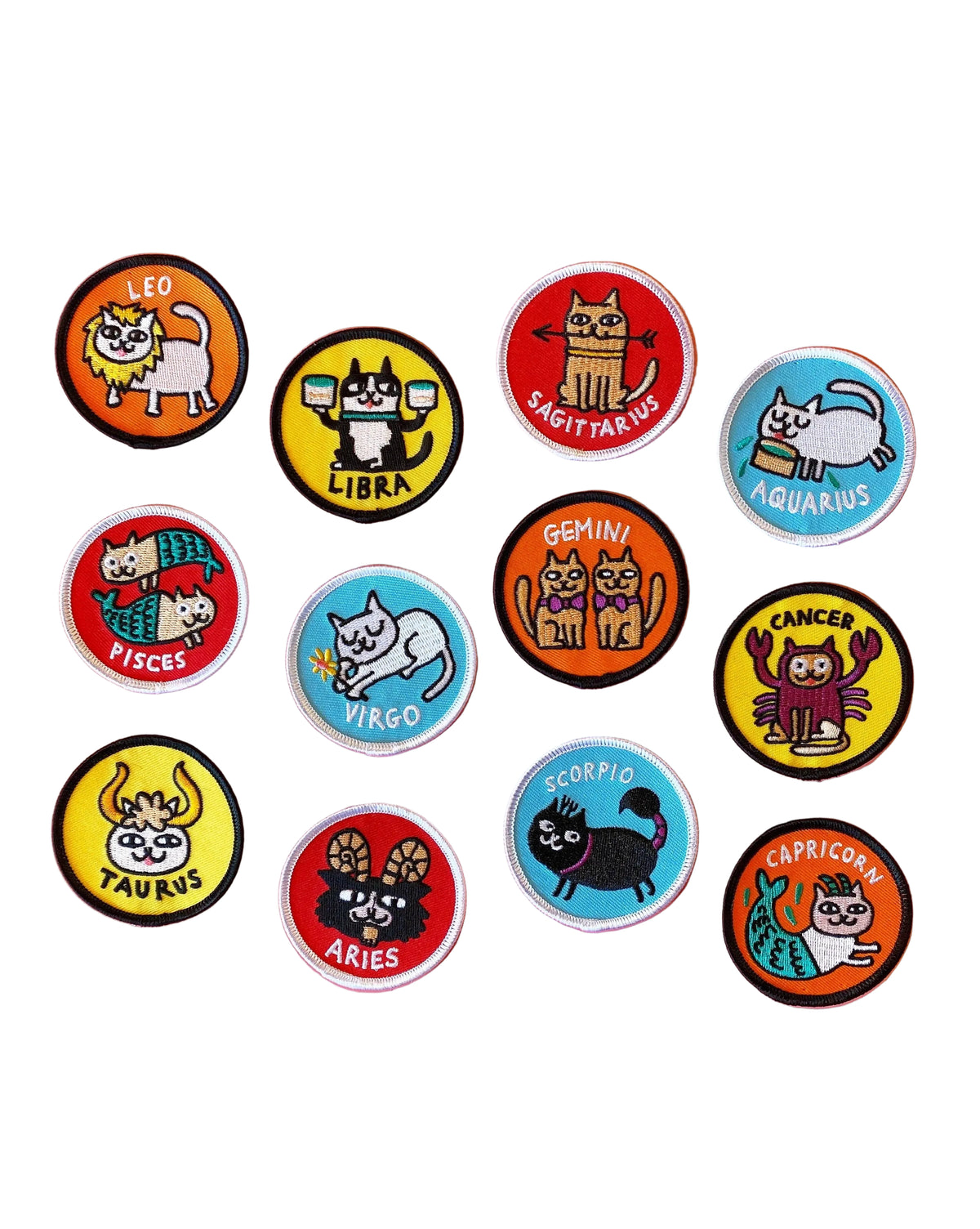 Set of zodiac-themed buttons with cartoon animals on a pink background