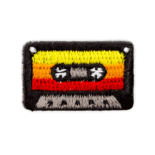 Embroidered patch of a cassette tape on a white background