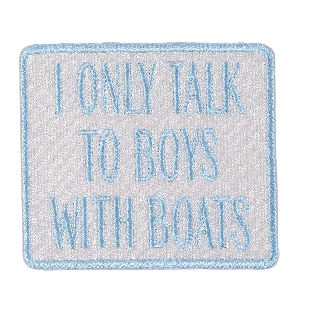 Embroidered patch with text 'I only talk to boys with boats' on a beige background