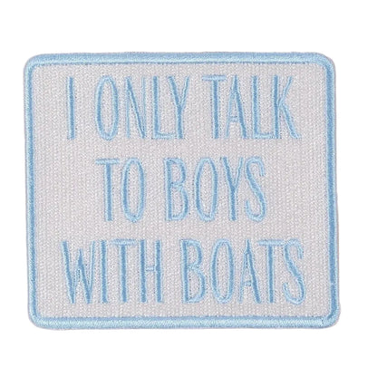 Embroidered patch with text 'I only talk to boys with boats' on a beige background