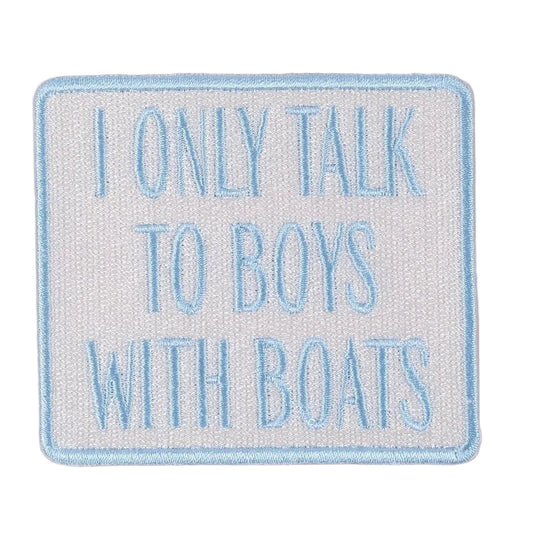Embroidered patch with text 'I only talk to boys with boats' on a beige background