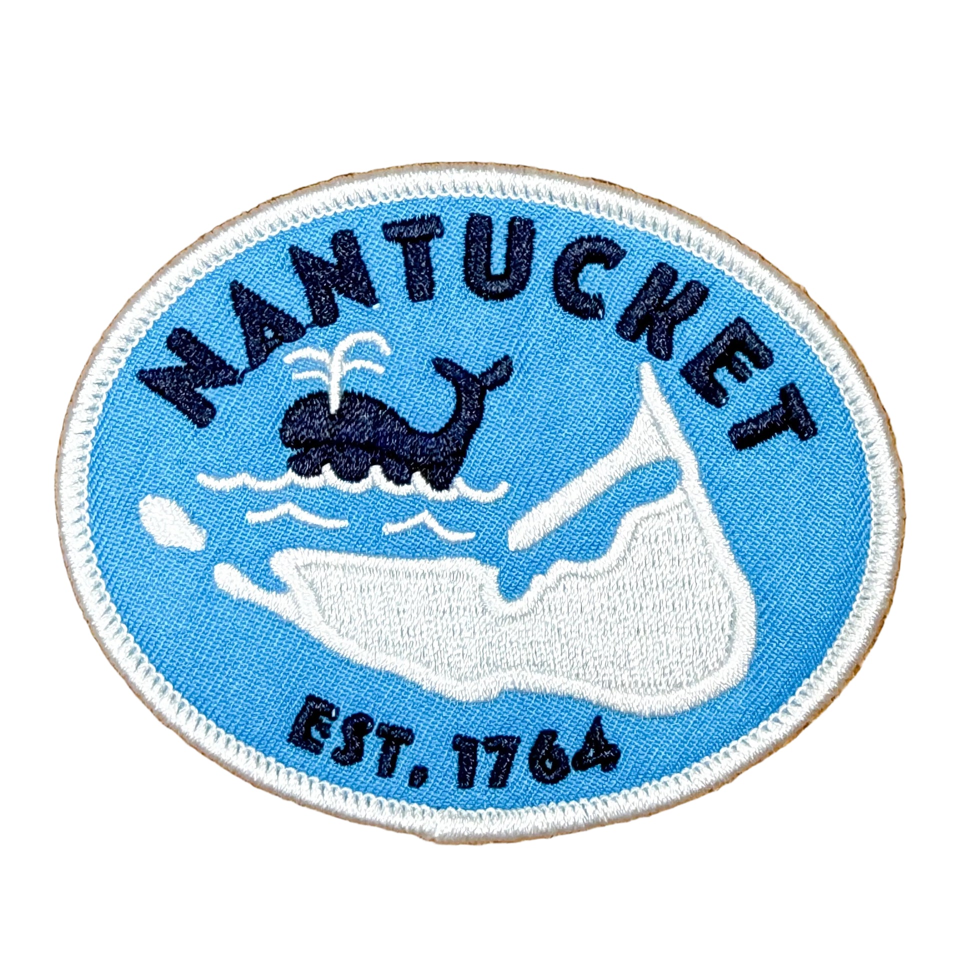 Nantucket patch with whale and sailboat design on a brown background