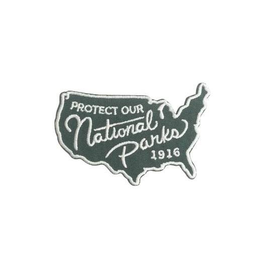 Patch with 'Protect Our National Parks 1916' text on a white background