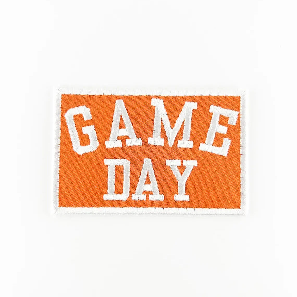 Embroidered patch with 'GAME DAY' text on an orange background