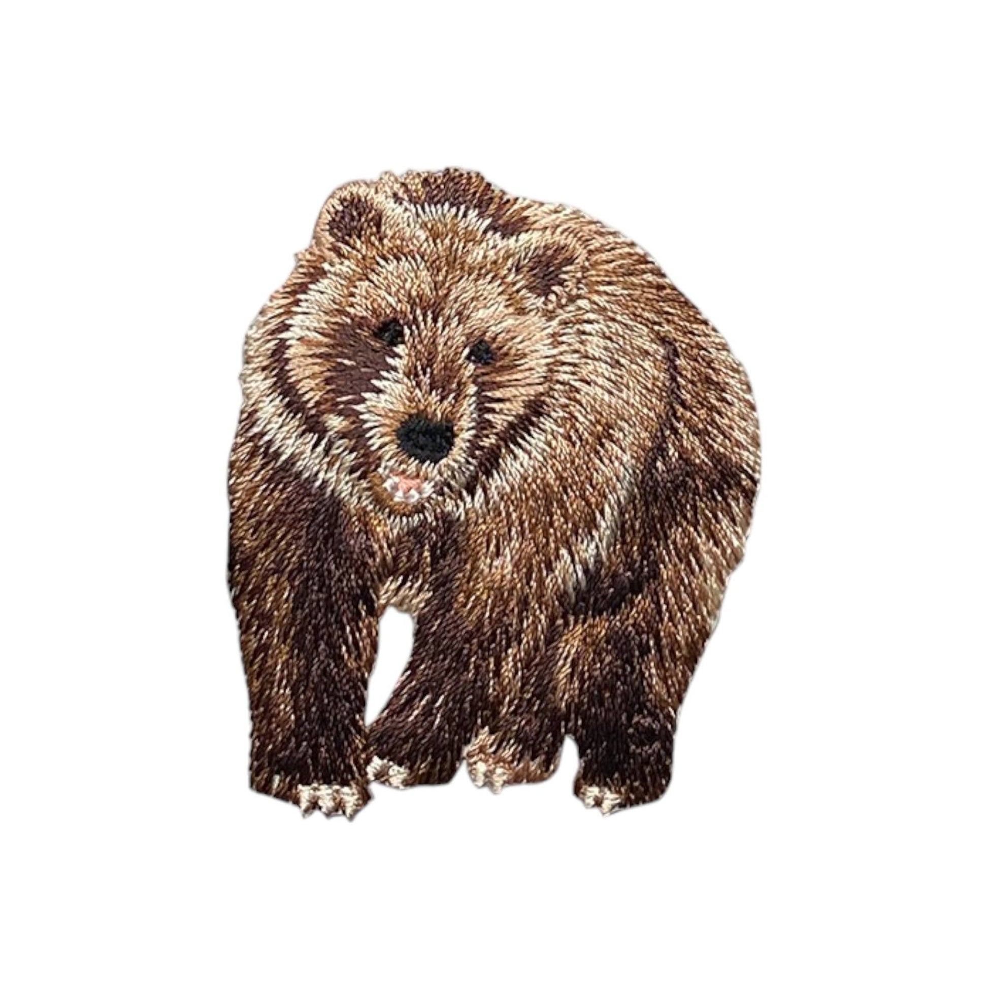 Embroidered bear patch on a white background