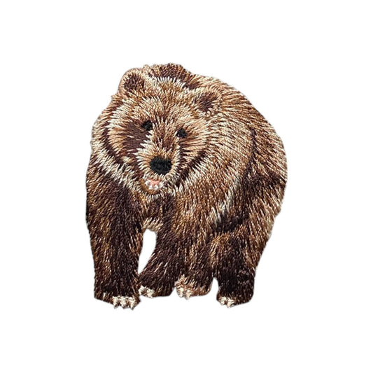 Embroidered bear patch on a white background