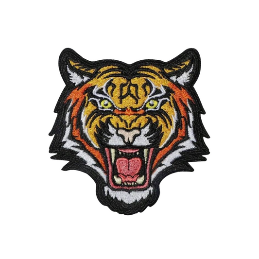 Embroidered patch of a tiger's head on a white background