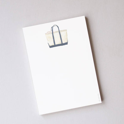 White tote bag with blue accents on a white background