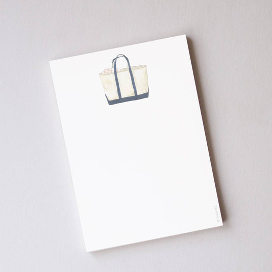 White tote bag with blue accents on a white background