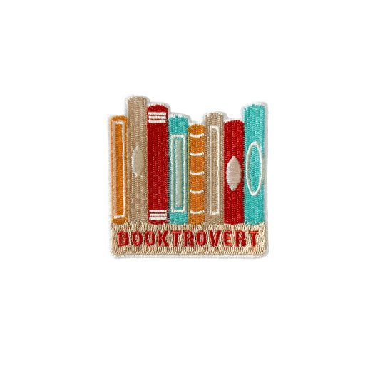 Embroidered patch with book design and 'BOOKTROVERT' text on a white background
