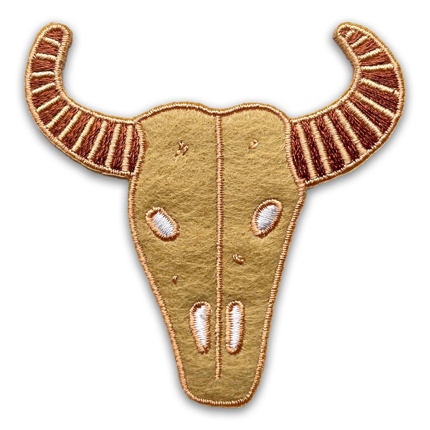 An embroidered bull skull patch with curved horns, featuring a textured tan background, brown and gold embroidered horns, and white embroidered eye and nose details, isolated on a white background.