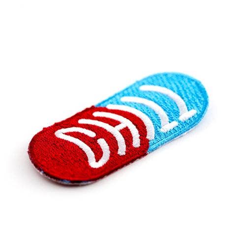 Red and blue slide toy with white accents on a white background