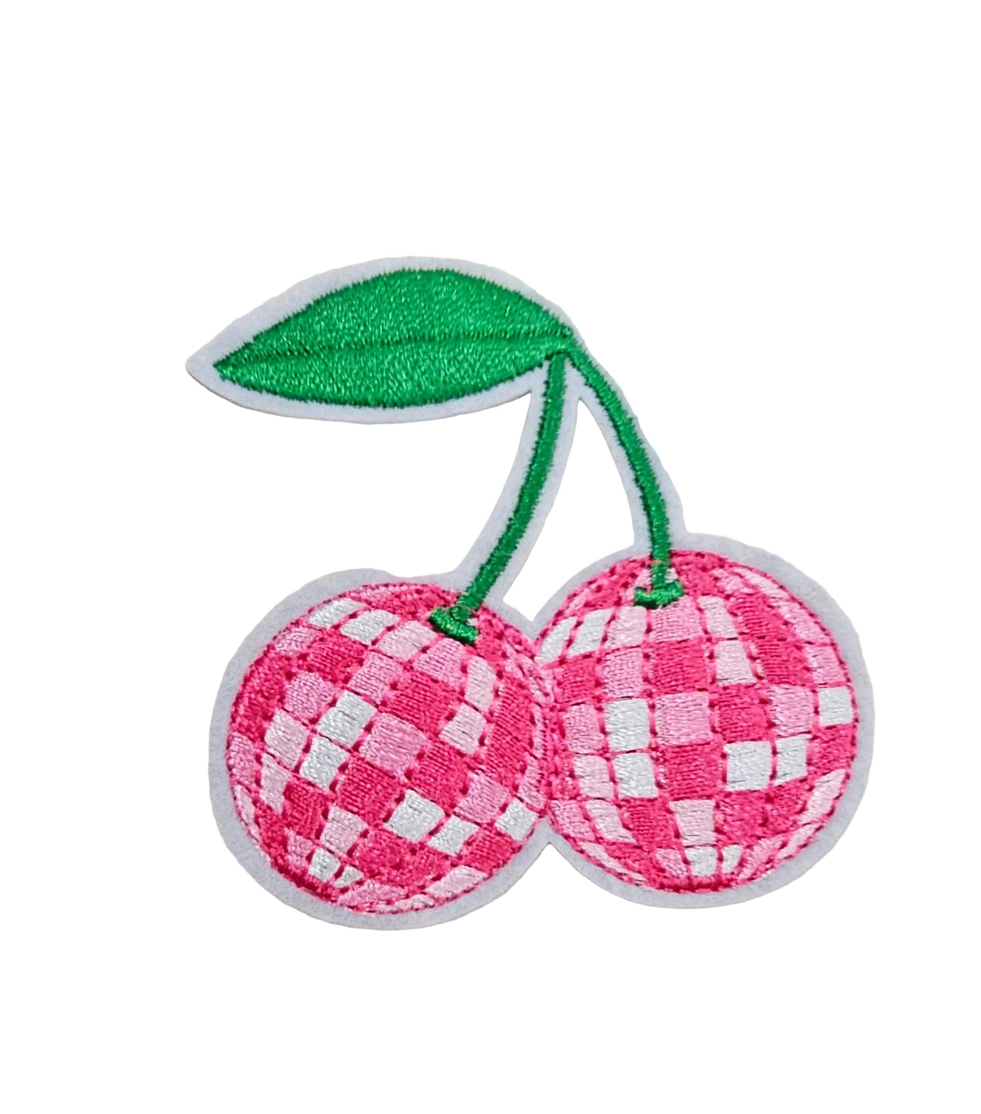 Pink checkered cherry patch with a green stem on a textured white background