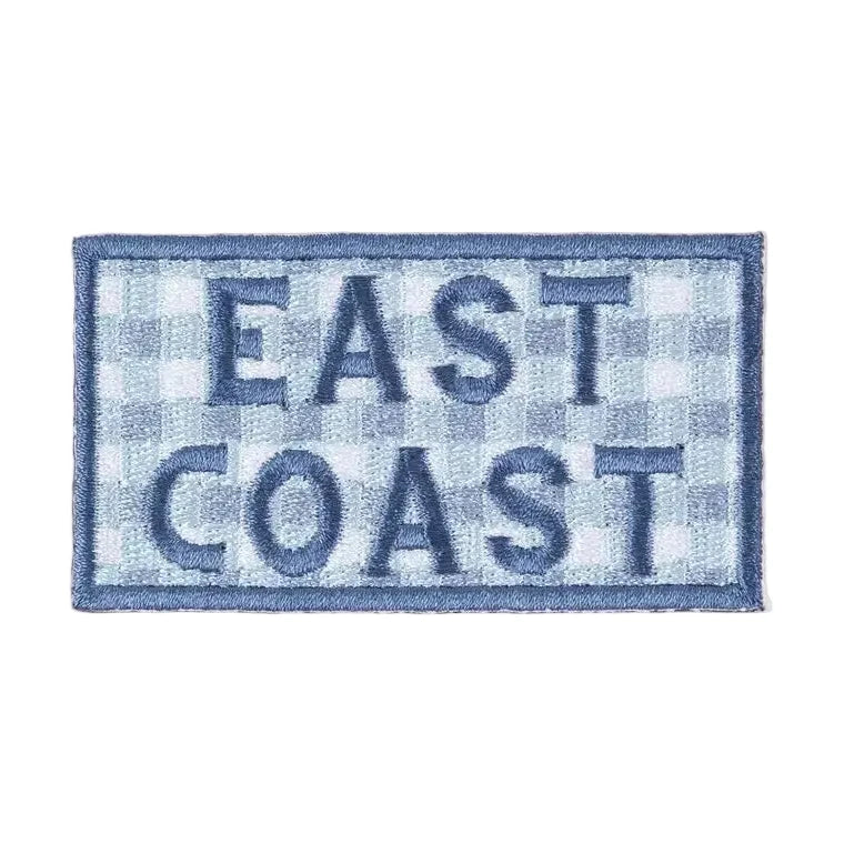 Patch with 'East Coast' text on a checkered pattern against a beige background