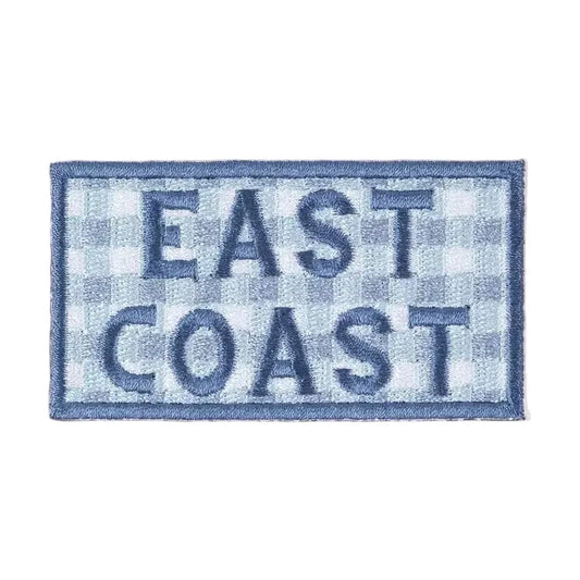 Patch with 'East Coast' text on a checkered pattern against a beige background