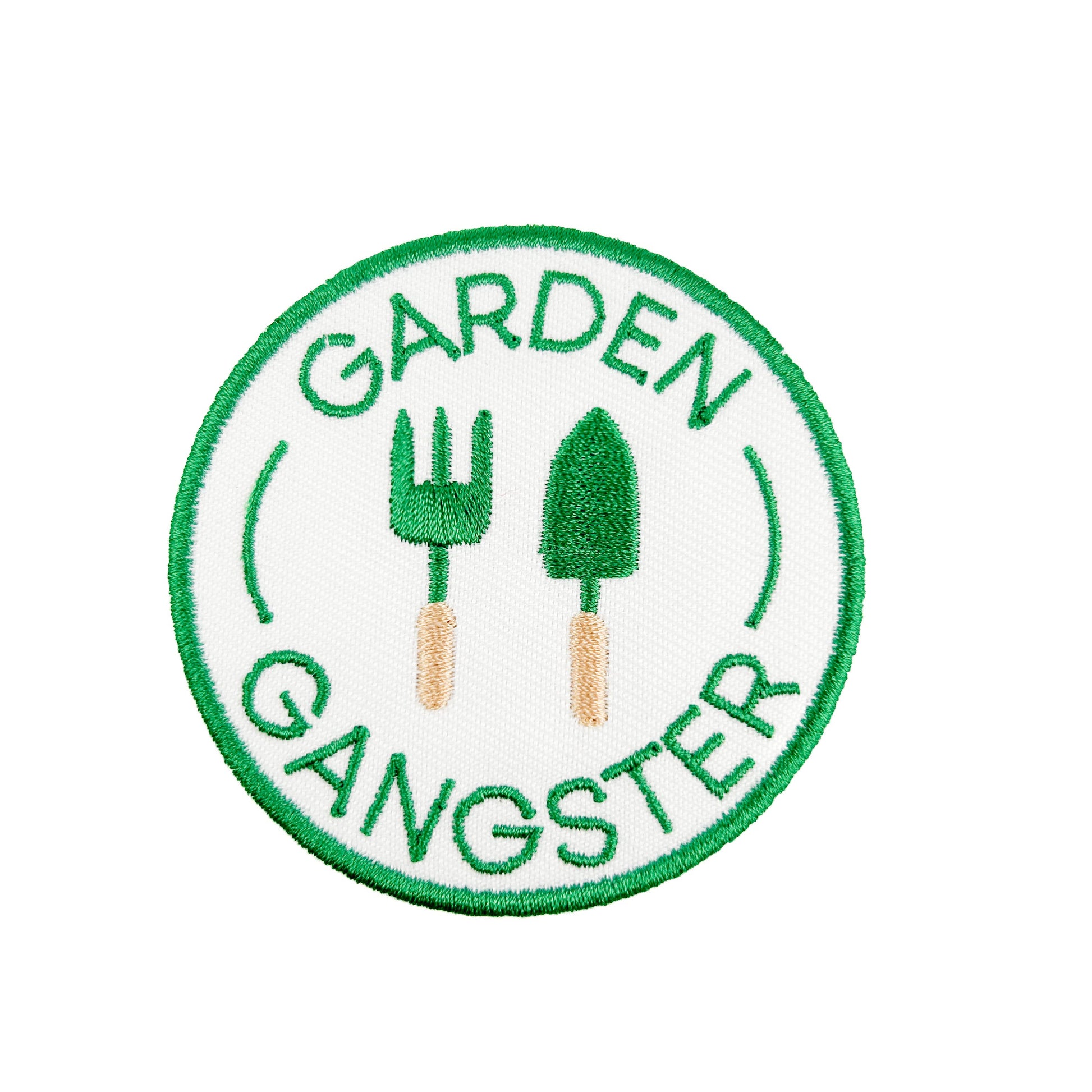 Circular patch with 'Garden Gangster' text and gardening tools on a white background