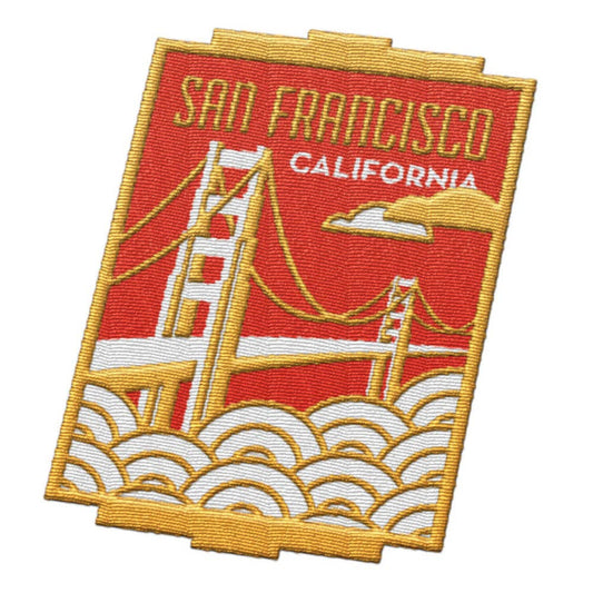 Embroidered San Francisco California patch featuring the Golden Gate Bridge, red sky, white waves, and gold border on a white background.