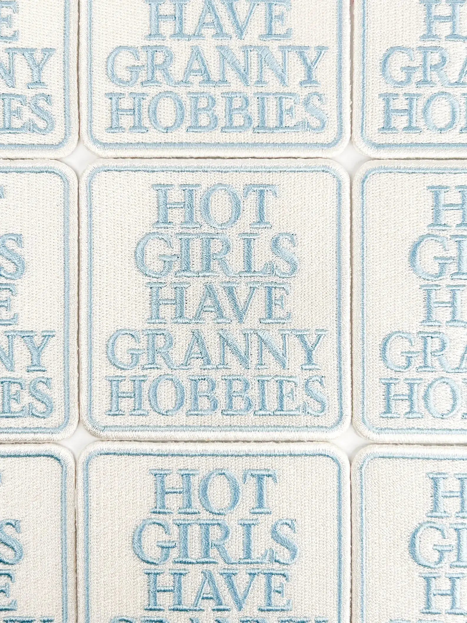Text pattern with phrases like 'Have Granny Hobbies' and 'Hot Girls Have Granny Hobbies' on a tiled background.