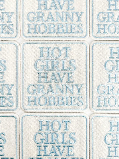 Text pattern with phrases like 'Have Granny Hobbies' and 'Hot Girls Have Granny Hobbies' on a tiled background.