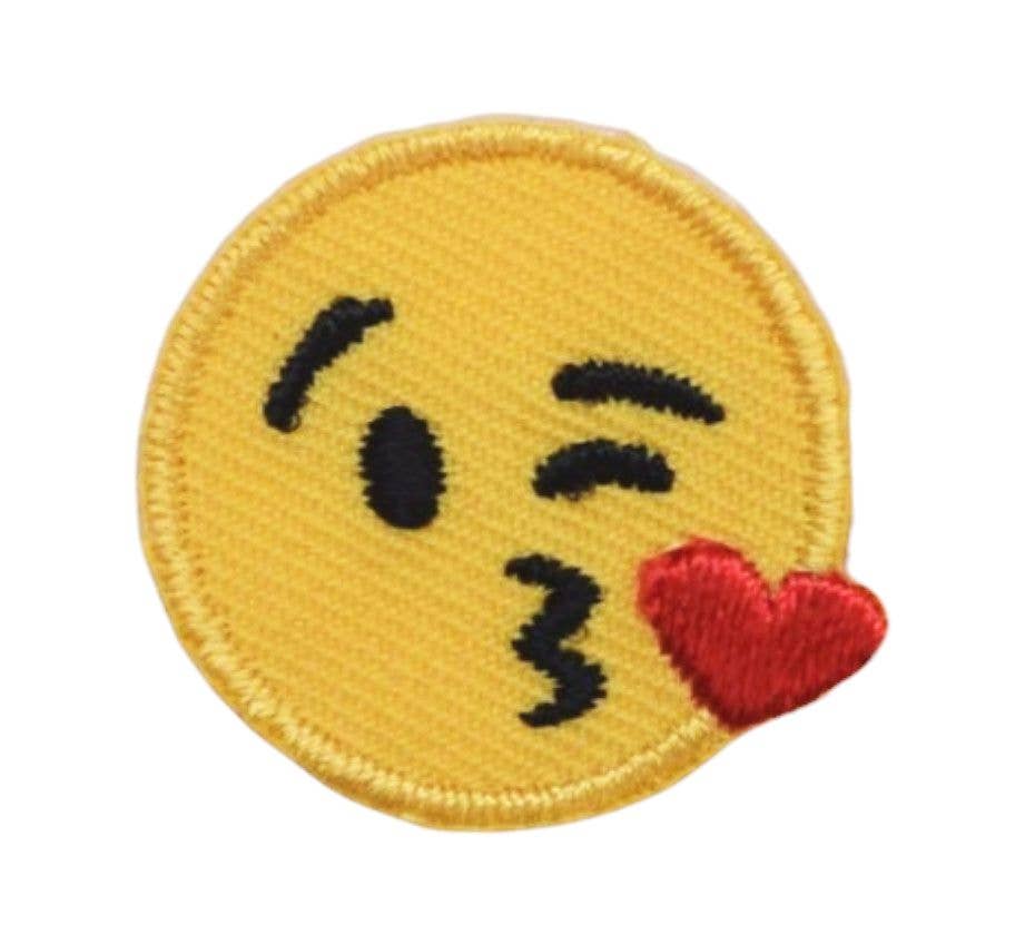 Emoticon patch with a kissing face and red heart on a yellow background