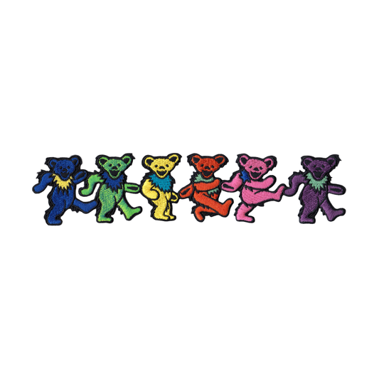 A row of six Grateful Dead-style dancing bears in different colors, including blue, green, yellow, red, pink, and purple, arranged horizontally on a plain white background.