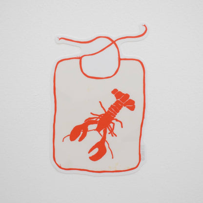 Bib with red lobster design on a white background