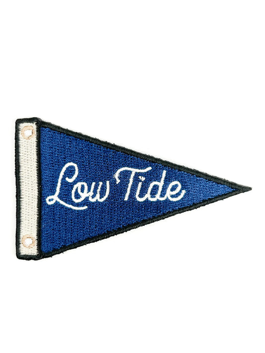 Blue pennant with 'Low Tide' text on a white background