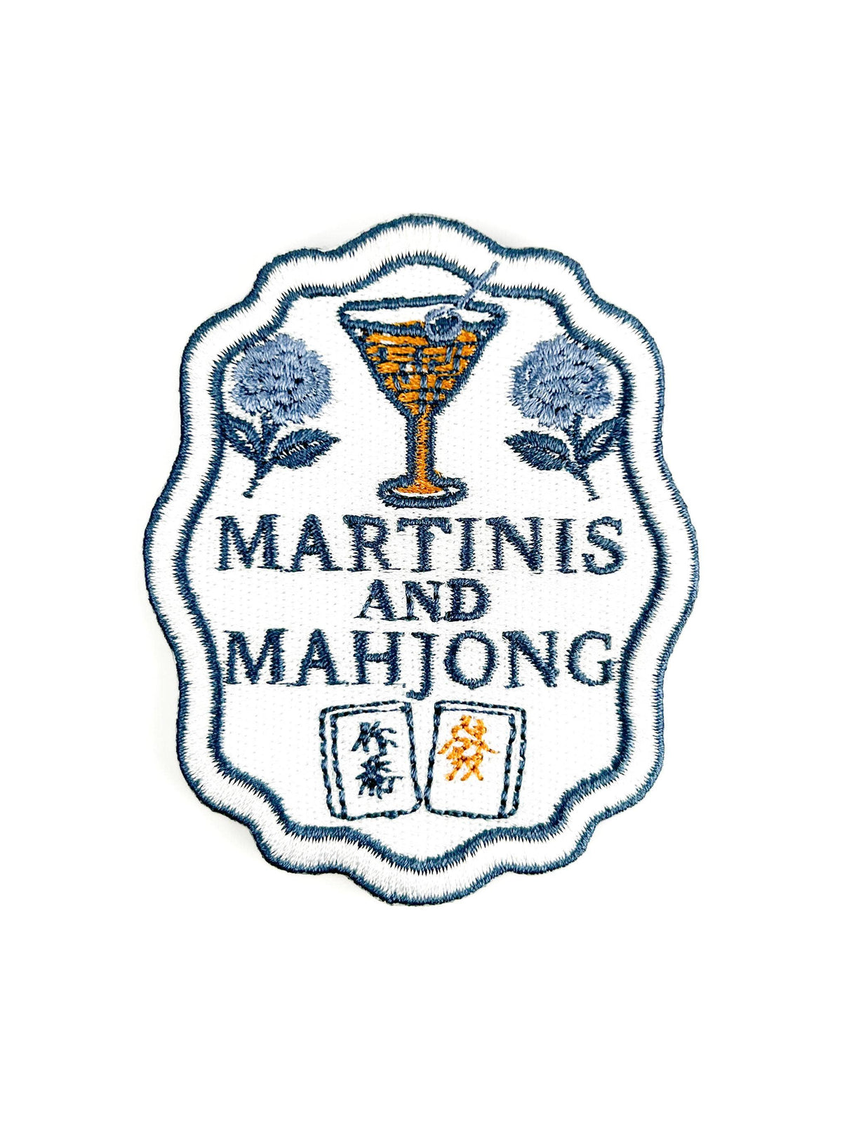 Embroidered patch with 'Martinis and Mahjong' text and a martini glass design.