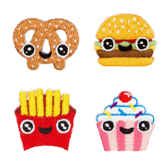 Set of four embroidered patches: pretzel, hamburger, french fries, and cupcake on a white background.