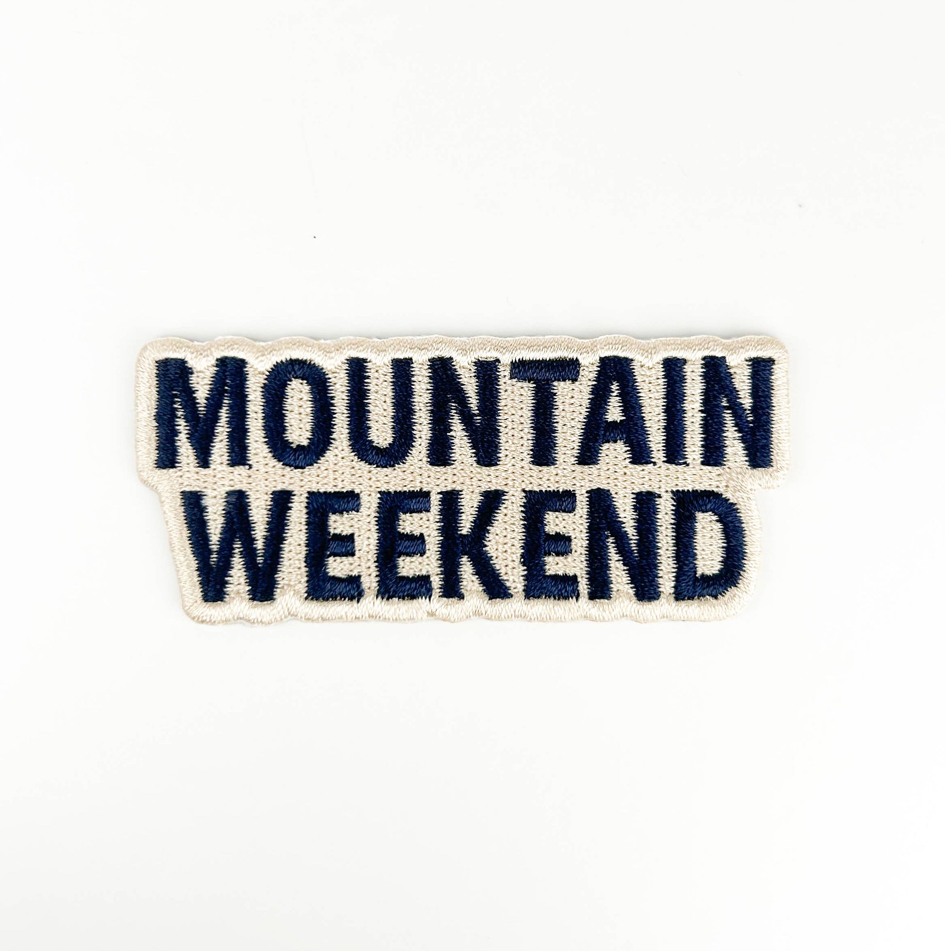 Text patch with 'Mountain Weekend' on a white background