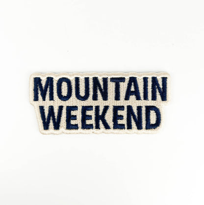 Text patch with 'Mountain Weekend' on a white background
