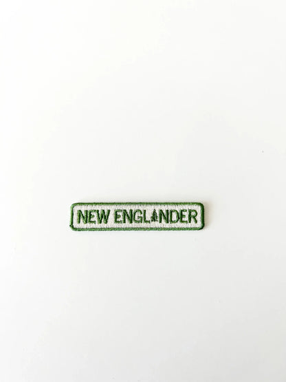 Text patch with 'NEW ENGLANDER' on a white background