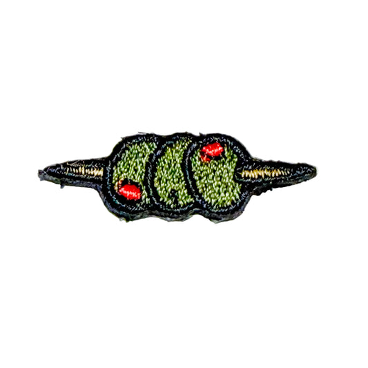Embroidered patch of 3 green olives on a toothpick on a white background