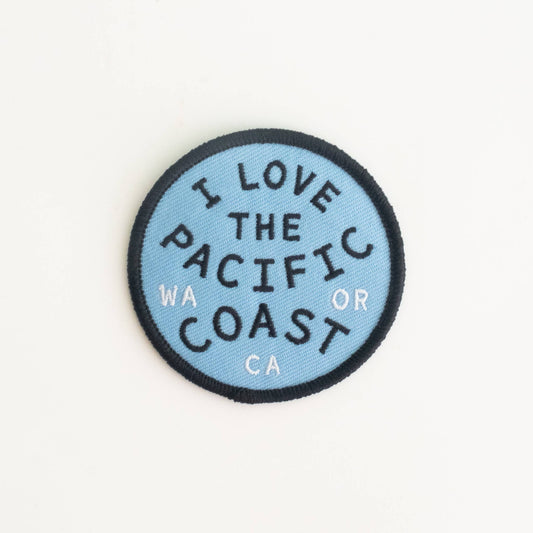 Round patch with 'I Love the Pacific Coast' text on a light blue background