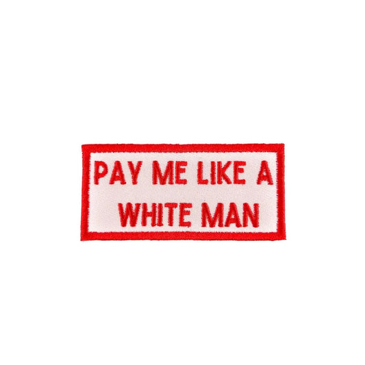 Patch with 'Pay Me Like A White Man' text on a white background