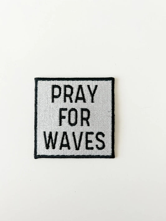 Text patch with 'PRAY FOR WAVES' on a white background