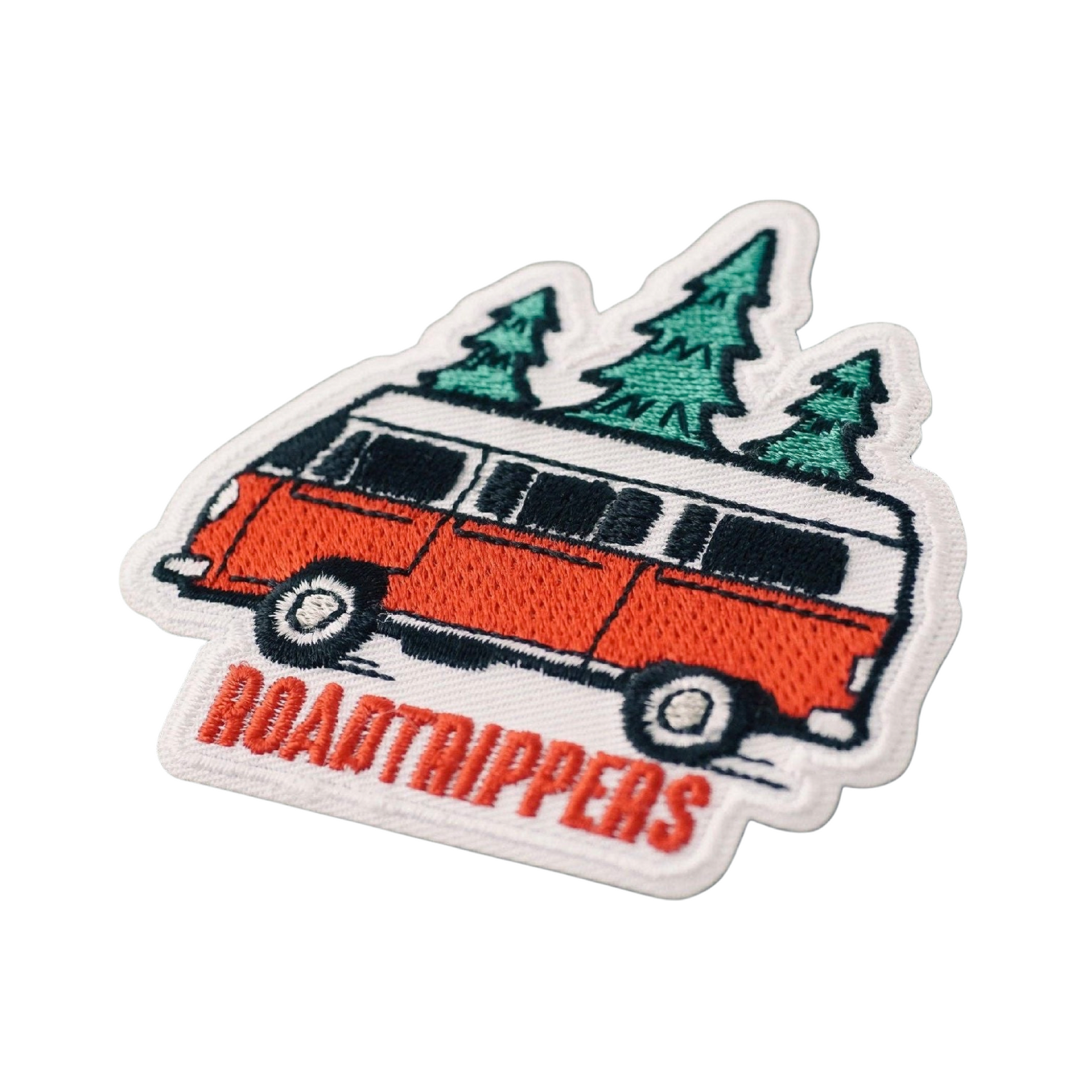 Embroidered patch of a van with trees and 'ROADTRIPPERS' text on a white background