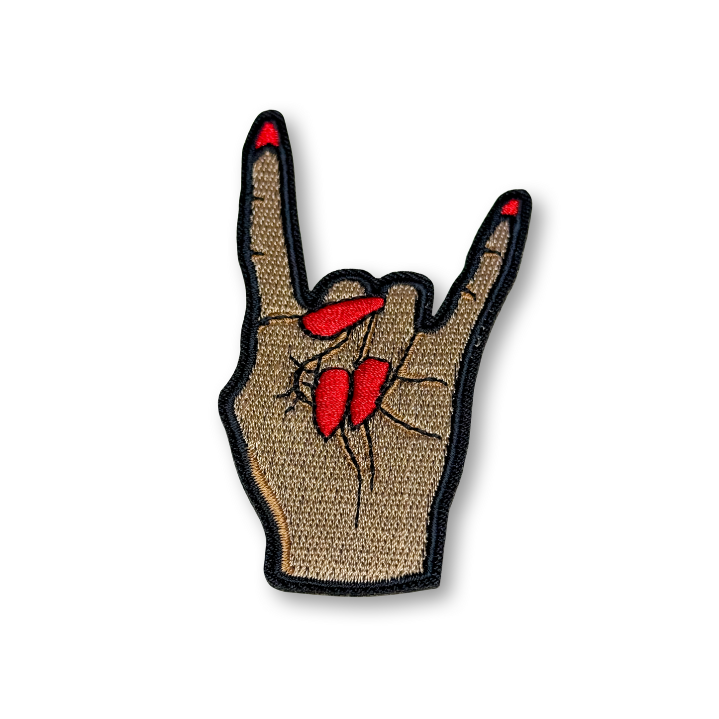 Handmade patch of a hand making a rock sign with red nails on a beige background