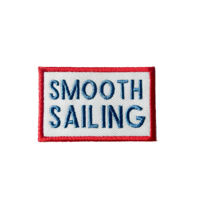 Embroidered patch with 'Smooth Sailing' text on a white background