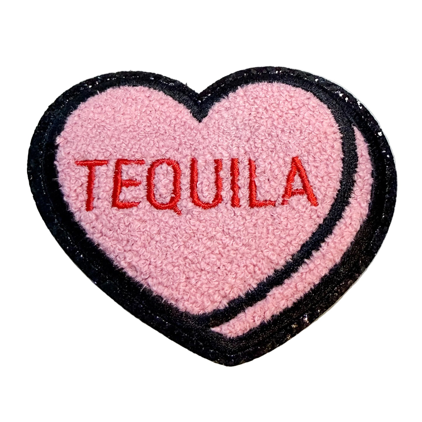 Heart-shaped patch with 'TEQUILA' text on a white background
