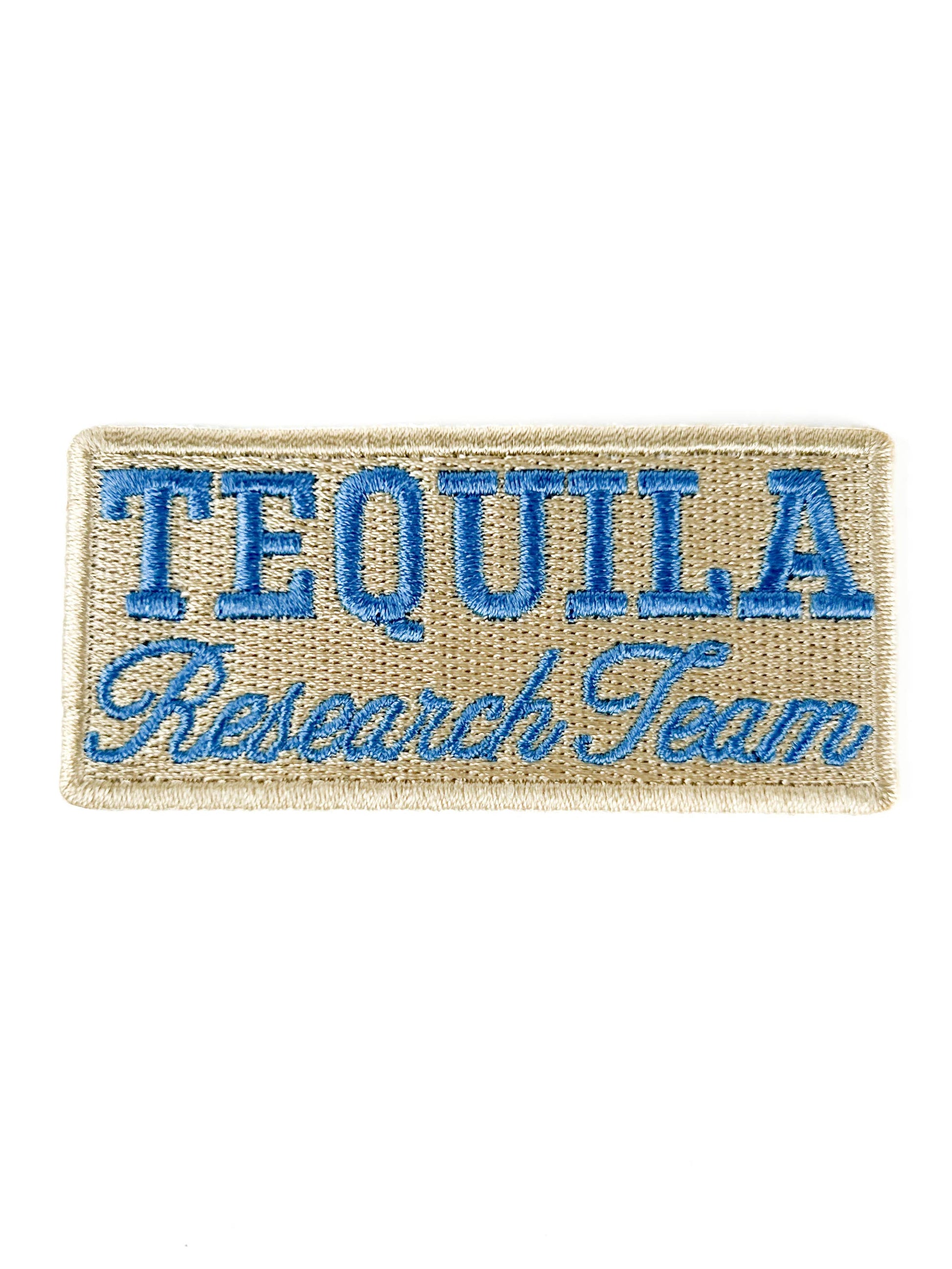 Embroidered patch with 'Tequila Research Team' text on a beige background